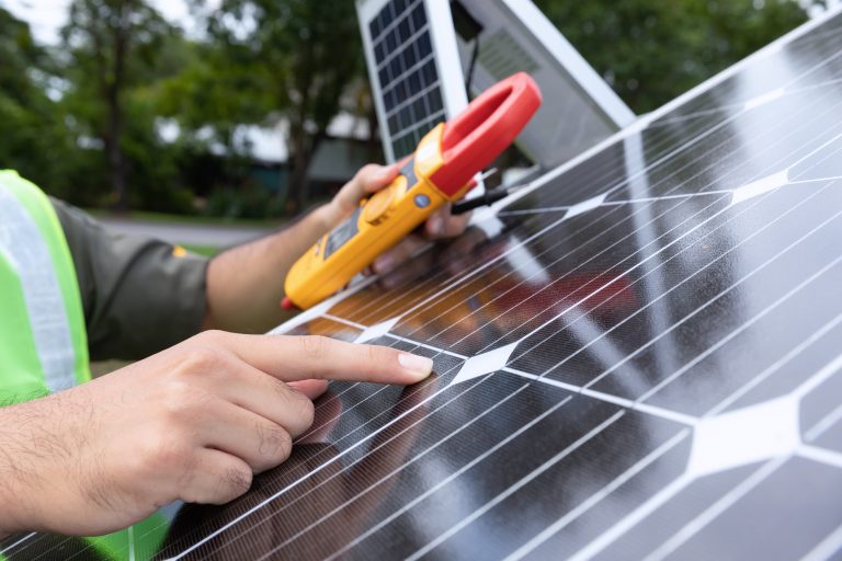 Engineer with energy measurement tool photovoltaic modules for renewable energy